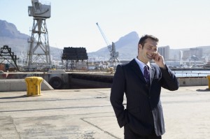 Portrait of a man talking on his mobile phone in an industrial setting